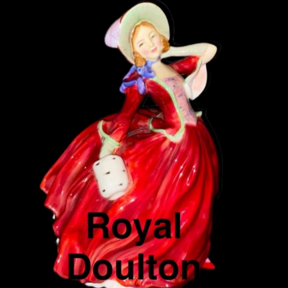 Royal Daulton,Porcelain Hand Painted Autumn Breezes Figurine by Leslie Harridin.